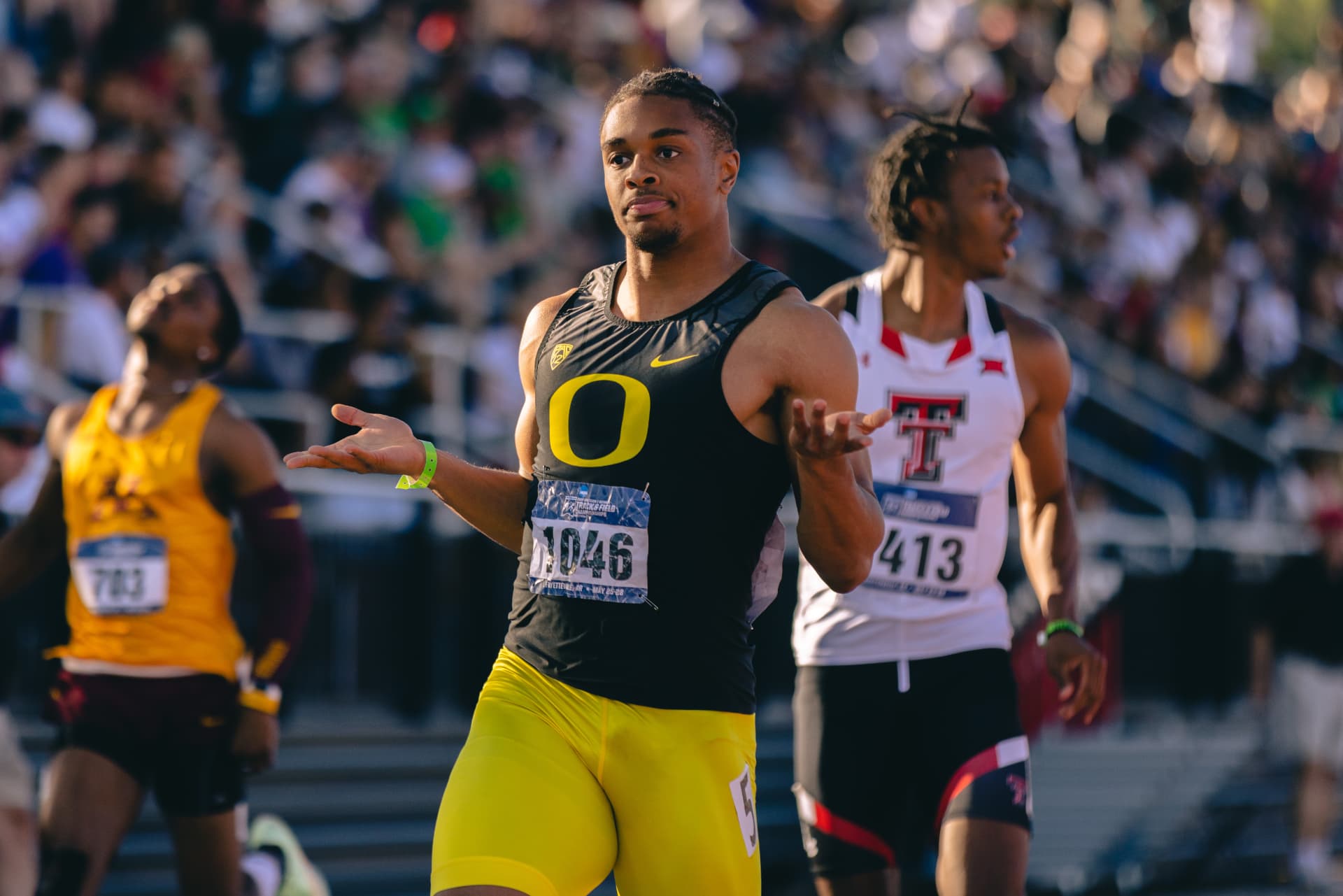 Micah Williams in his Oregon uniform reacting after a sprint final
