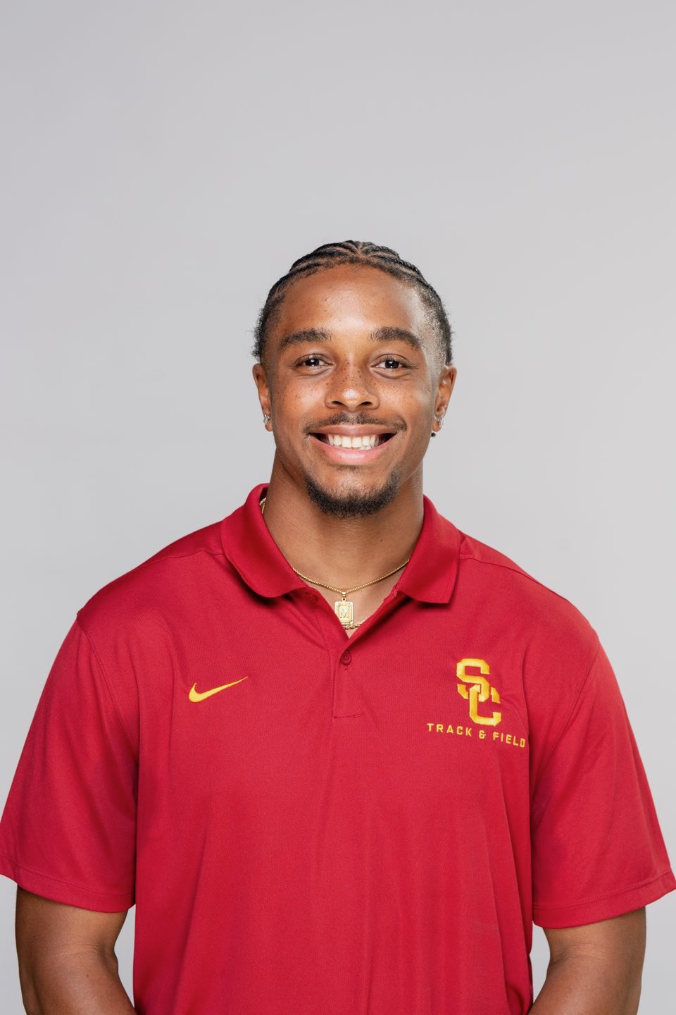 Portrait of Micah Williams wearing a USC Track & Field polo